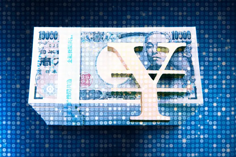 10000円札と大きなYJロゴ Mastercardのロゴが表示された画像。.